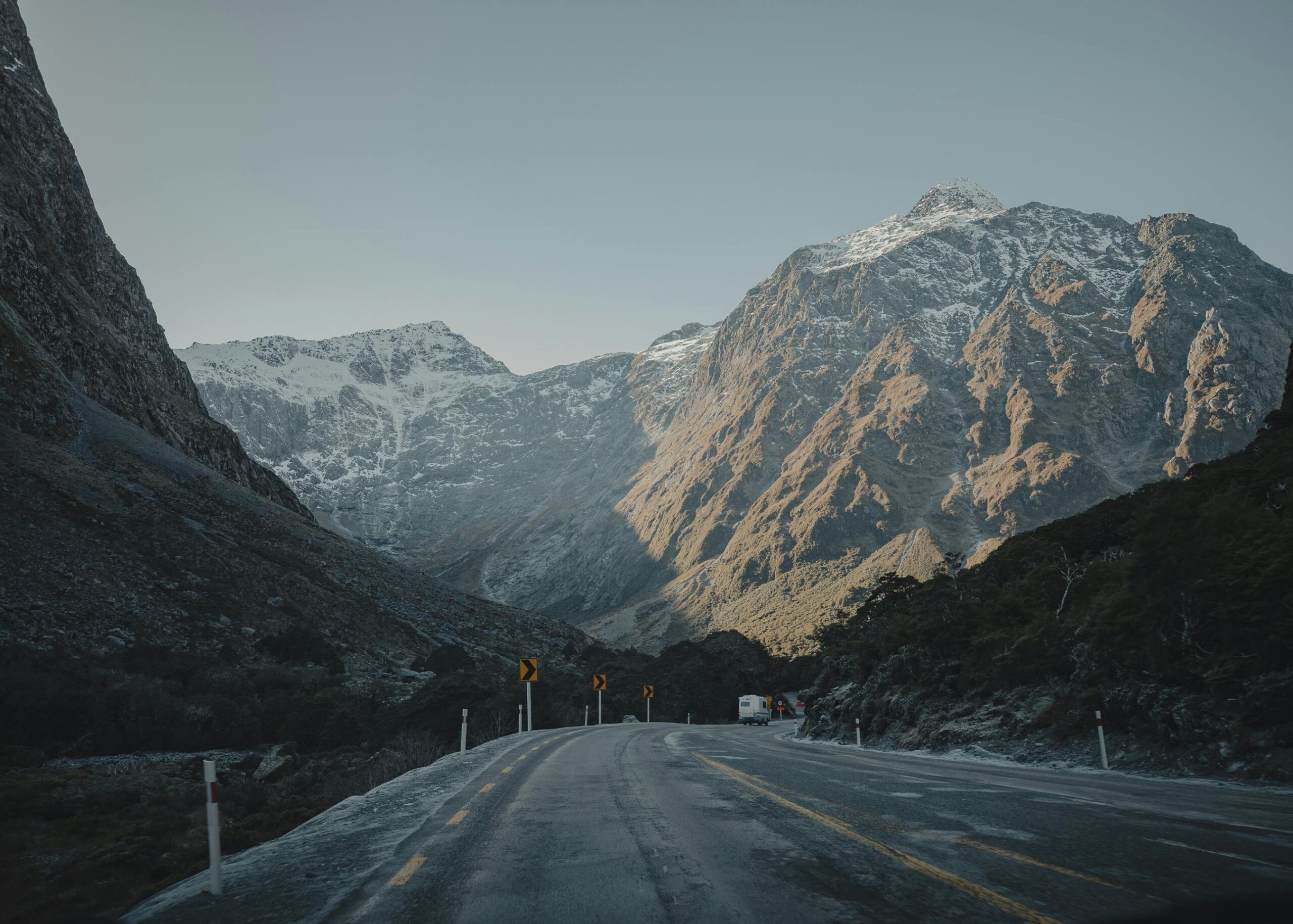 Snow-dusted mountain pass and road at dusk, New Zealand